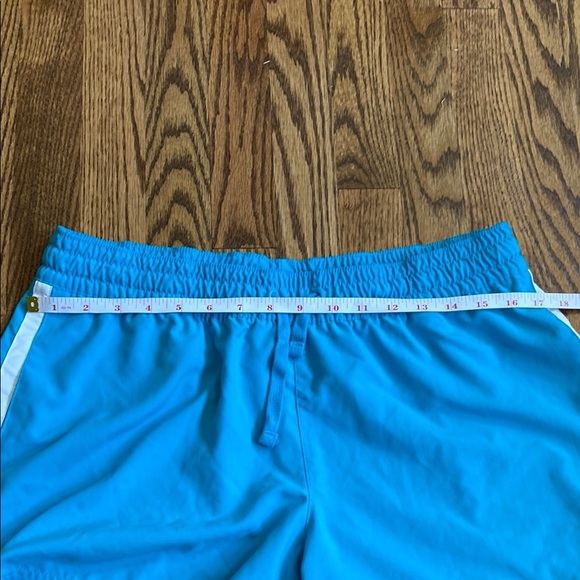Bright turquoise with white side stripe Nike shorts with pockets, size women’s L - Picture 16 of 16